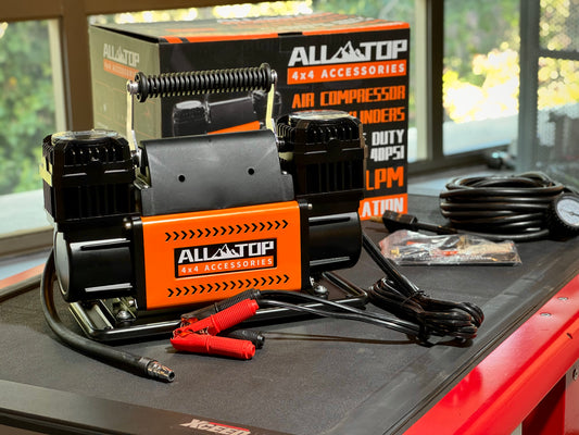 ALL-TOP Compresor de Aire portable air compressor with cables and coil hose on workbench