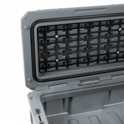 Toolbox TRIBU caja de herramientas gris abierta con compartimento interior y rejilla en la tapa